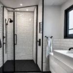 A modern bathroom with a newly renovated walkin shower featuring white subwayfeat